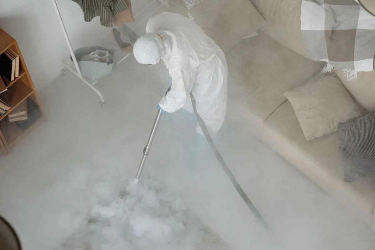 Biohazard cleanup technician in protective equipment, Baileyton, AL